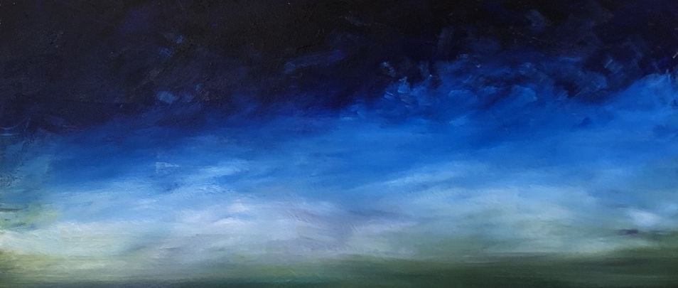 A band of night sky, deep indigo shading down into luminous blue.